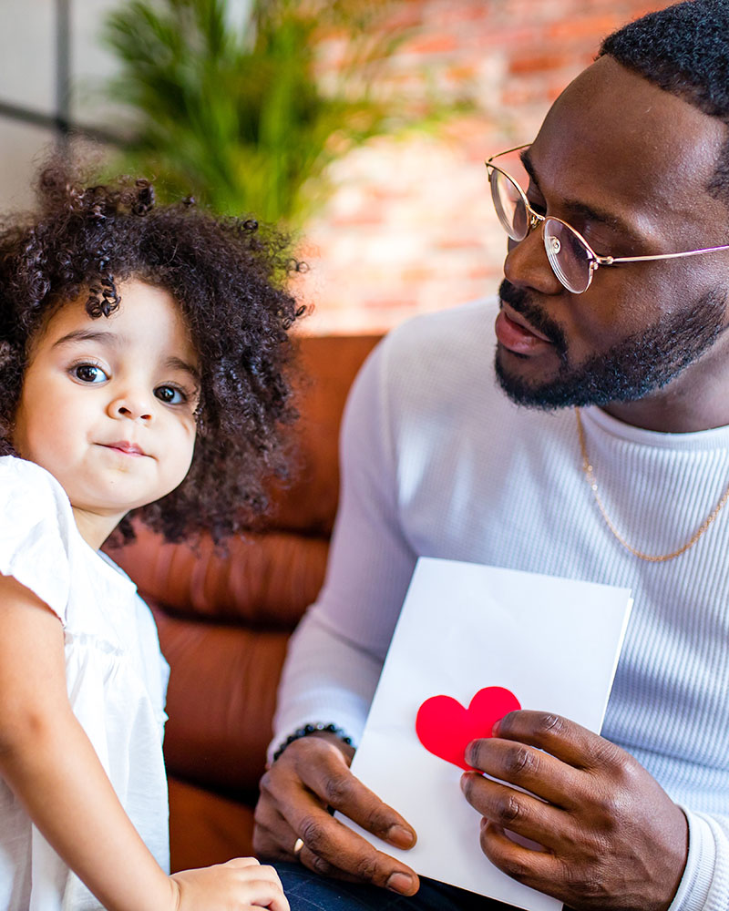 man staring at little girl